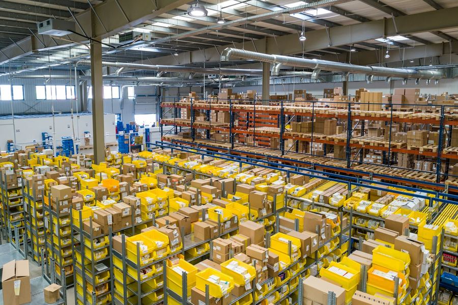 Fulfillment center with order totes ready for packing