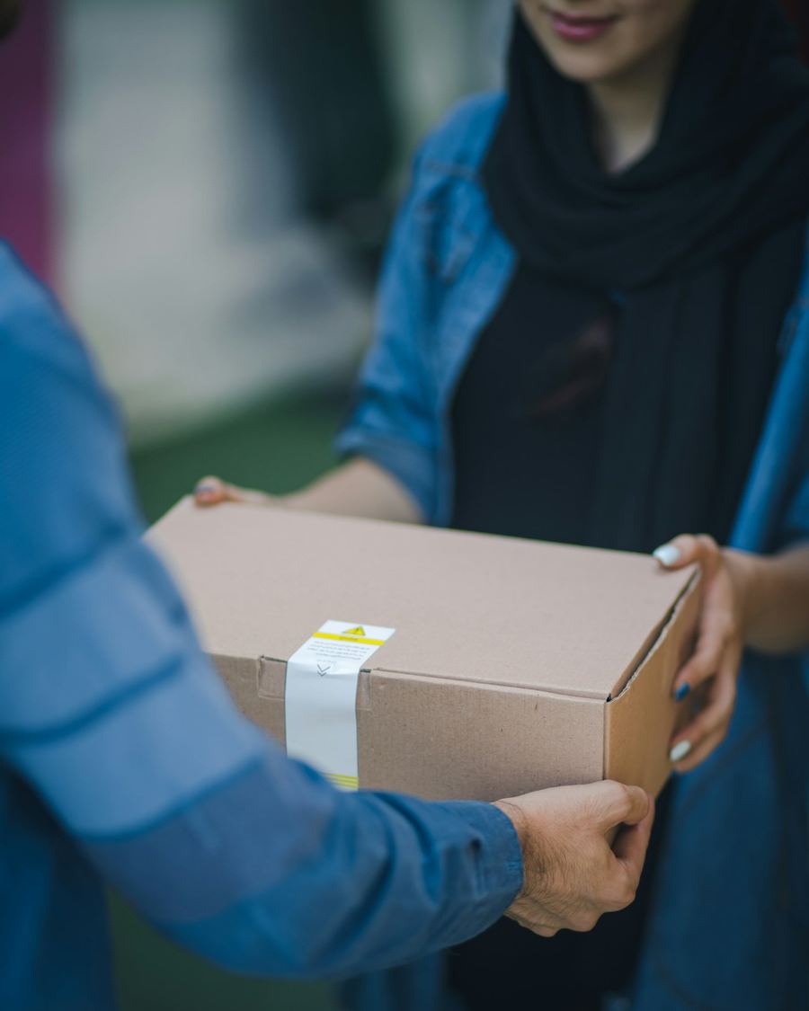 Packed parcel being handed over for shipment